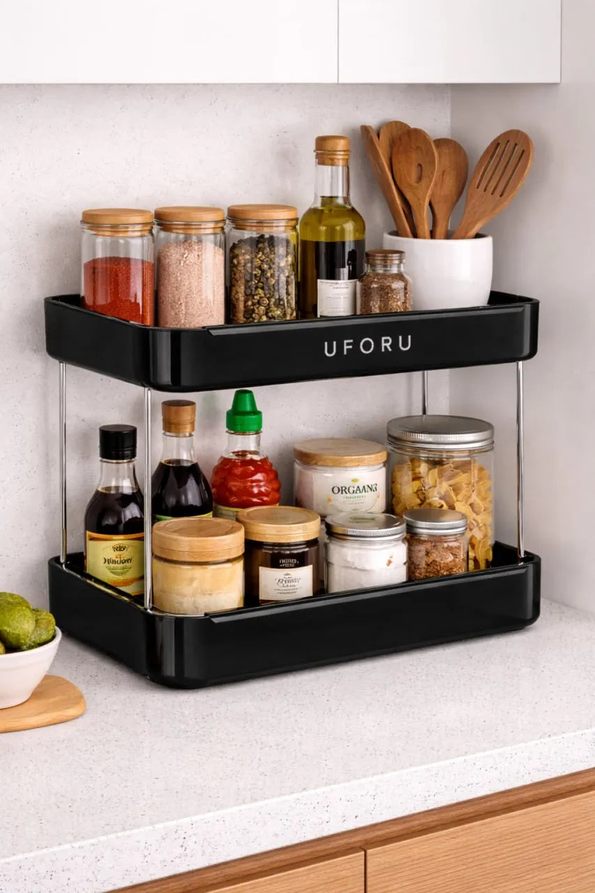 Black UFORU kitchen organizer with spices and utensils on a countertop.