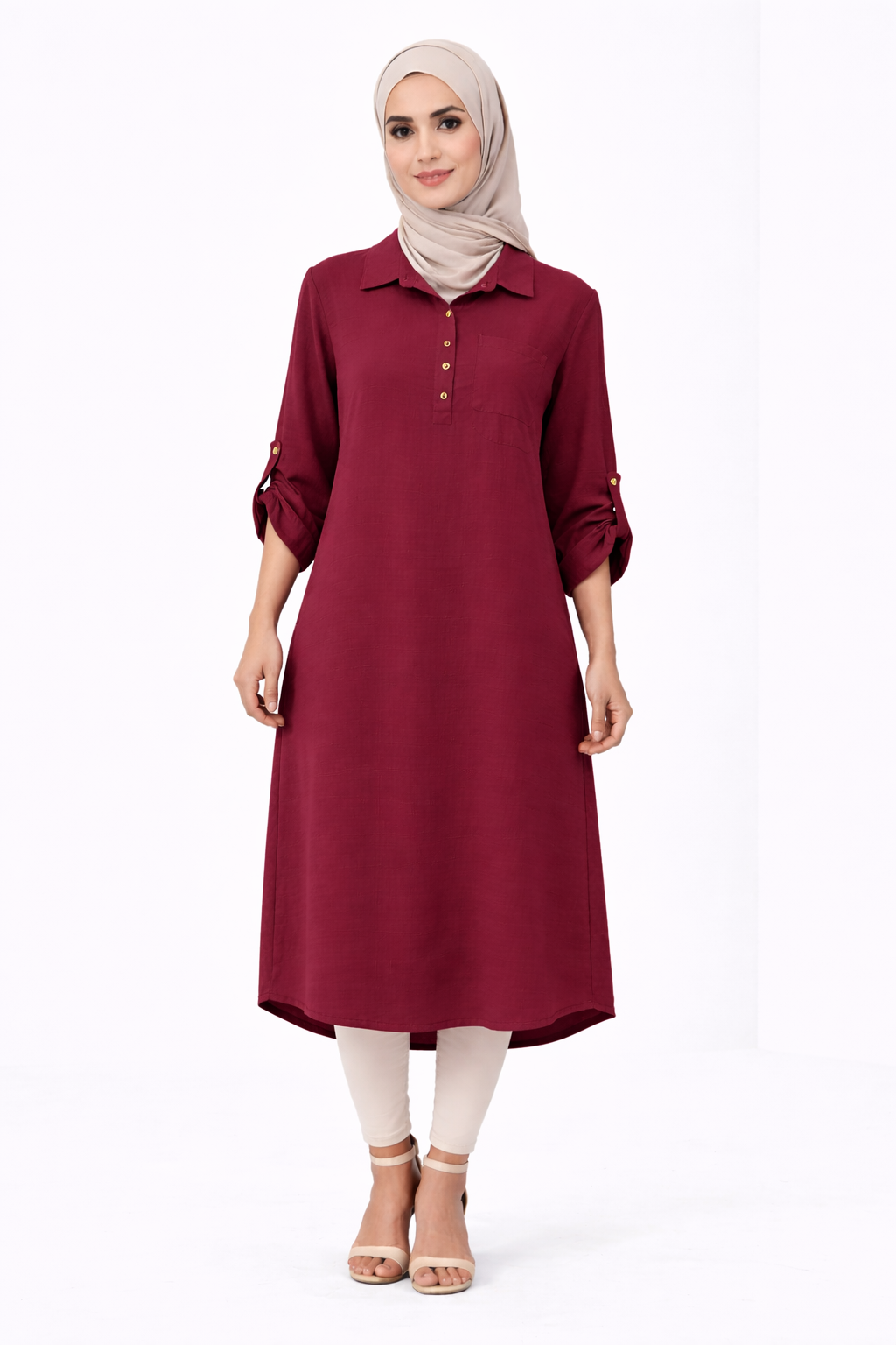 Woman wearing a burgundy dress with a beige hijab on a white background