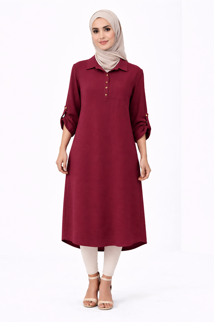 Woman wearing a burgundy dress with a beige hijab on a white background