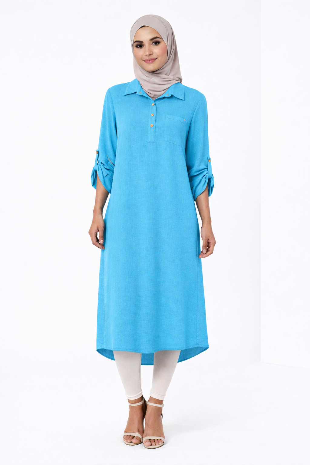 Woman wearing a blue kurta with white pants on a white background